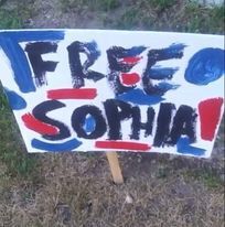 "Free Sophia" campaign sign